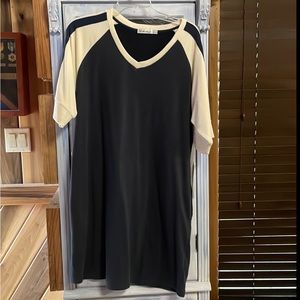 Another Love brand navy blue with white sleeves. Size Large. New with tags.